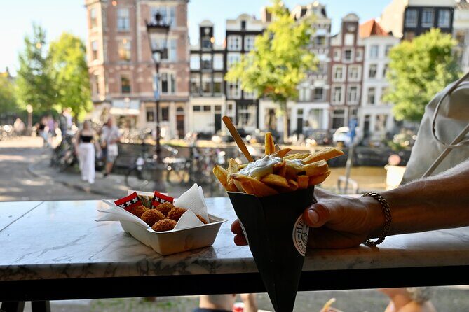 10 Tastes of Amsterdam: Food Tour by UNESCO Canals and Jordaan - Bloemenmarkt on the Singel Canal and the Chocolate Stop Duo