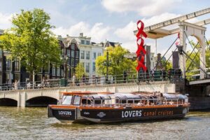 Amsterdam 1h Canal Cruise by Semi-Open Boat with Audio Guide - The route in plain English: canals, towers, bridges, and iconic stops