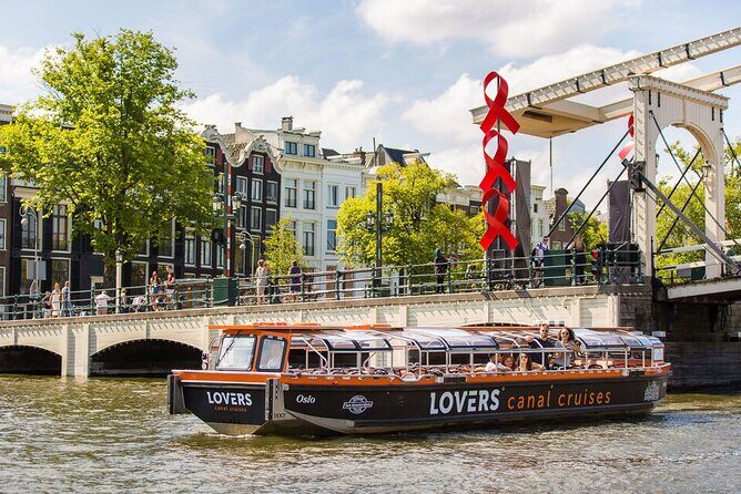 Amsterdam 1h Canal Cruise by Semi-Open Boat with Audio Guide - The route in plain English: canals, towers, bridges, and iconic stops