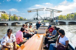 Amsterdam: 75 minute Open Boat Canal Cruise with Live Guide - Where to Meet (and How to Not Miss Departure)