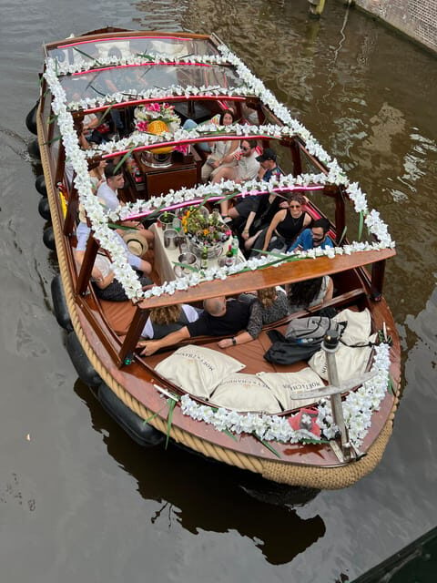 Amsterdam: Boat Tour with Optional Unlimited Drinks - Stepping aboard the Enterprise in Amsterdam’s canal maze
