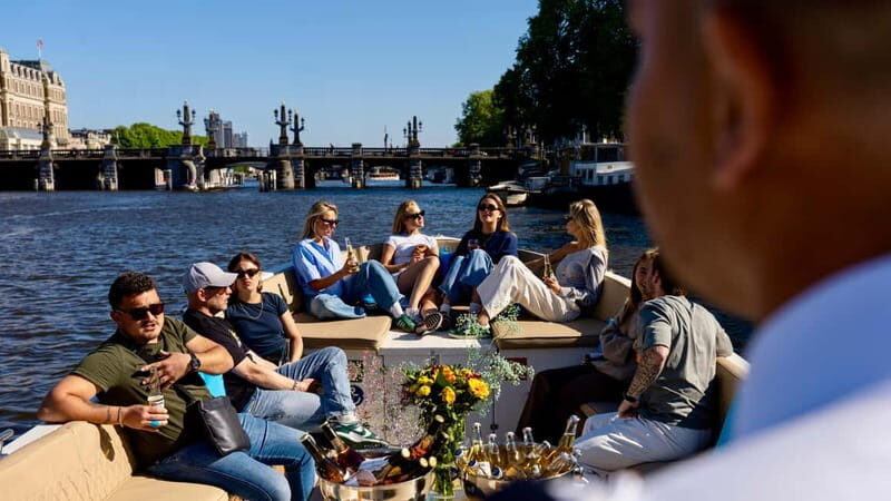 Amsterdam: Canal Cruise in Open Boat with Drink Option - Live guiding in English or Dutch: what you’ll actually learn