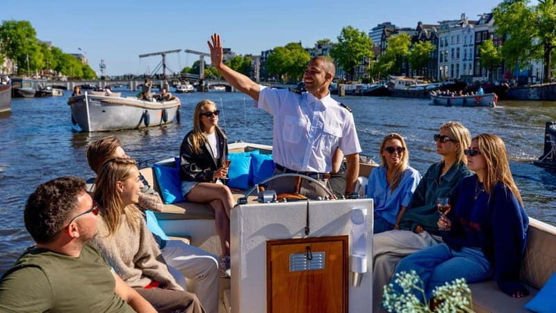 Amsterdam: Canal Cruise in Open Boat with Drink Option - The open-boat ride and that 100% electric engine hum