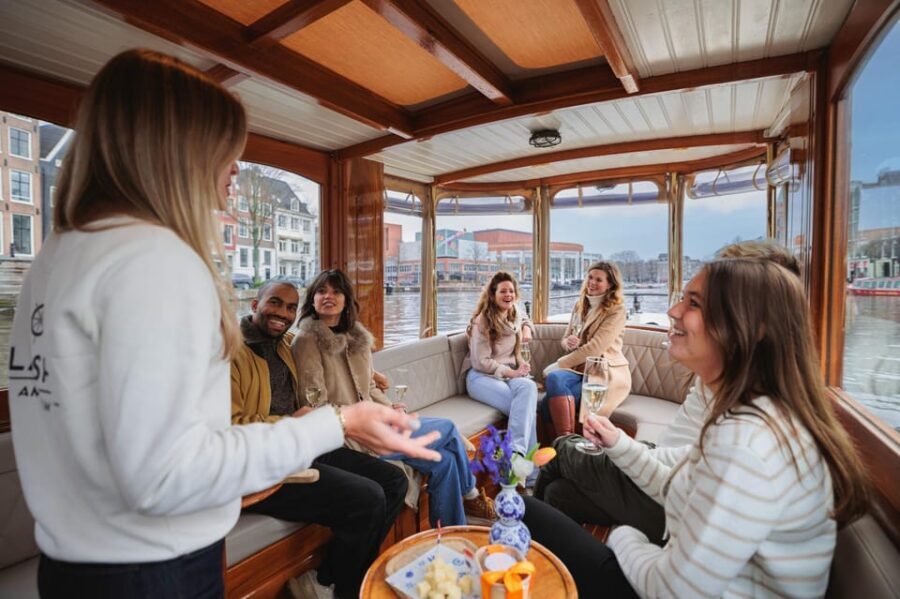 Amsterdam: Canal Cruise with Bubbles & Bites - Boarding the boat: covered comfort, the one big step, and the no-luggage rule
