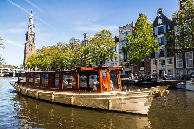 Amsterdam Canal Cruise with Cheese and Wine - Boarding the Wooden Boat: Size, Seating, and Comfort