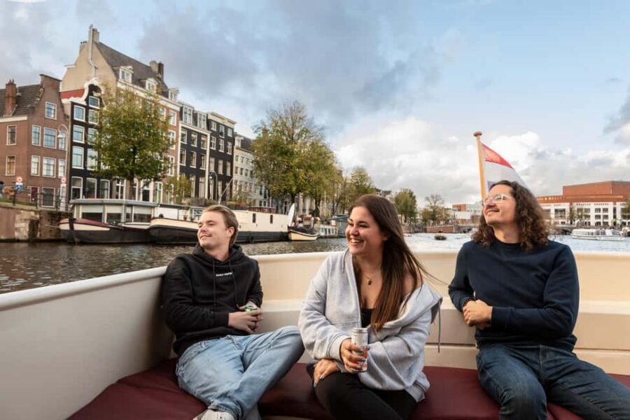 Amsterdam: Canal Cruise with Live Commentary & Audio Guide - Live captain commentary + audio guide: how to get the most out of both
