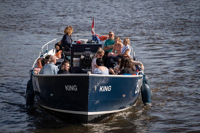 Amsterdam Canal Cruise with Live guide & Two drinks - Central St. - Red-Light District, Old Church, and Central Station from the Water