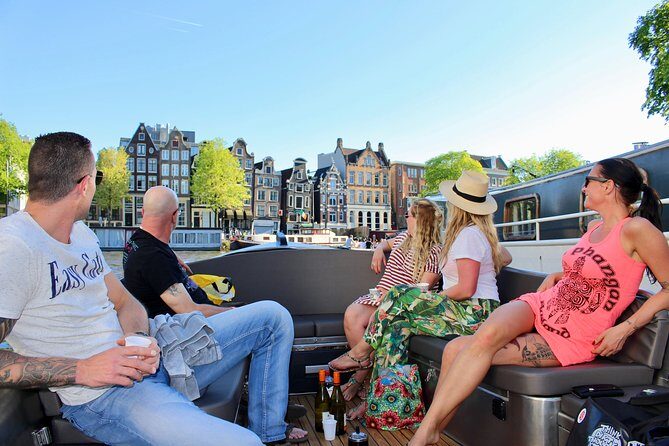 Amsterdam Canal Tour by Open Boat – 90 min Small Group Experience - Amstel River start: dancing houses and leaning buildings from the water