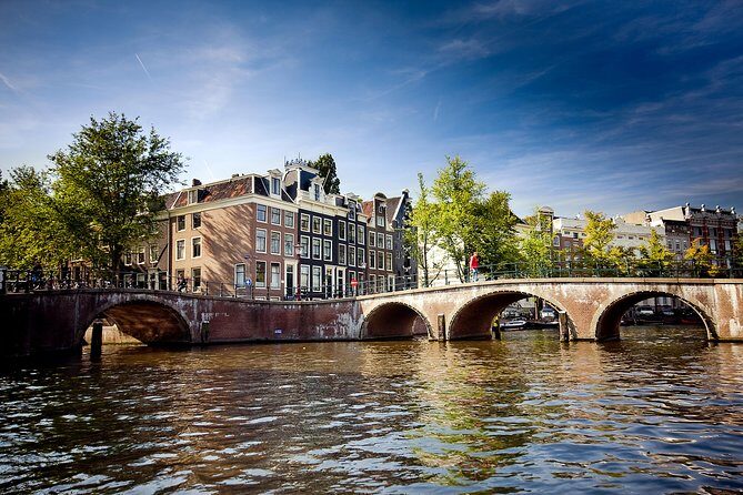 Amsterdam City Centre Cruise on heated boat with Audioguide - Timing tips: rain-proof cruising and the photo window window