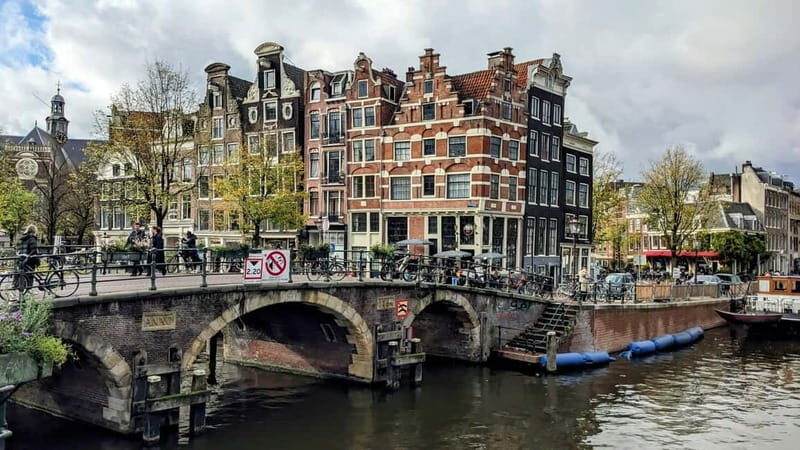 Amsterdam: City walking experience with a local - Where you start at Beursplein and how the 2 hours flow
