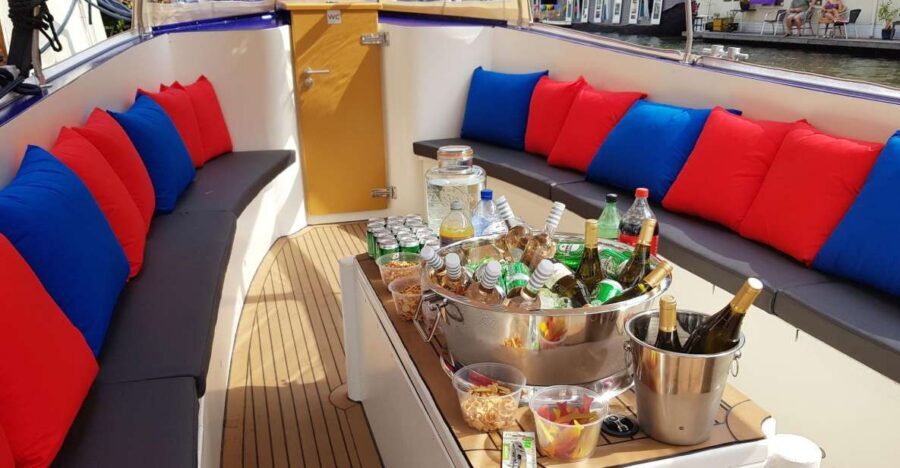Amsterdam: Covered Canal Booze Cruise with Unlimited Drinks - The Covered Boat, Warm Blankets, and How Rain Changes the Mood
