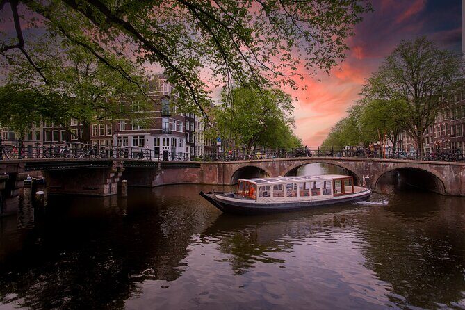 Amsterdam Evening Canal Cruise with Live Guide and Onboard Bar - Stop-by-Stop Highlights From the Water