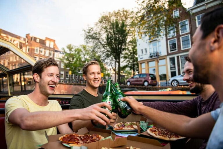 Amsterdam: Evening Pizza Cruise Along the Canals - The Heated Boat Experience: Comfort for a Night Cruise