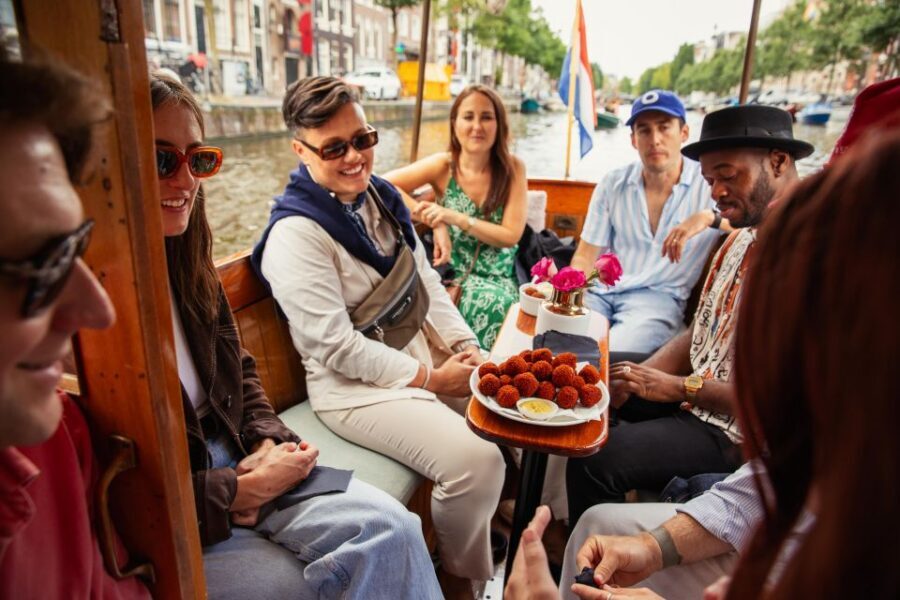 Amsterdam: Food and Canal Tour - Your one-hour UNESCO canal cruise: what to expect when the weather cooperates