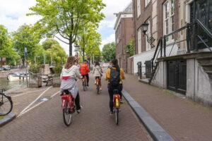 Amsterdam: Guided Bike Tour City Centre in EN/DE/FR/ES - Central Amsterdam first: A’DAM Tower and the Western Islands