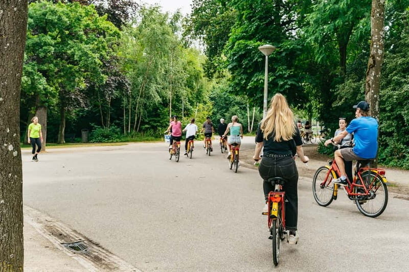 Amsterdam: Guided Bike Tour City Centre in EN/DE/FR/ES - Leidseplein Square and the nightlife edge