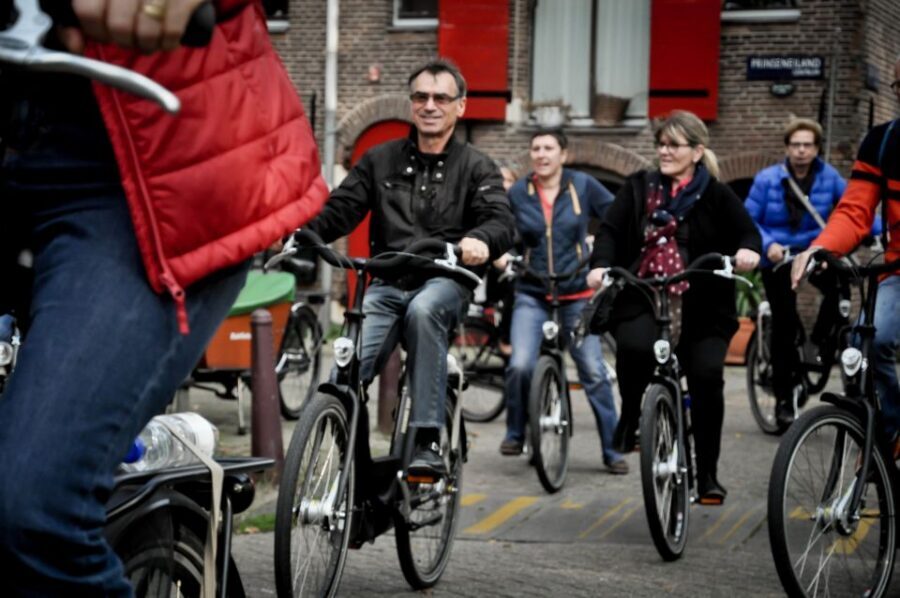 Amsterdam: Guided City Bike Tour in French - Key highlights worth knowing