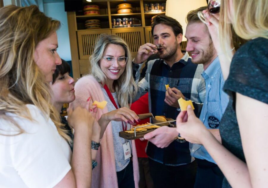 Amsterdam: Guided Cultural Food Tour in German or English - Damrak Avenue and Beurs van Berlage: architecture cues without the homework