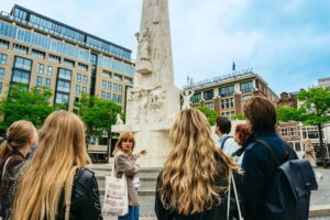Amsterdam: Guided Cultural Walking Tour - Meeting at the National Monument: start where Amsterdam remembers