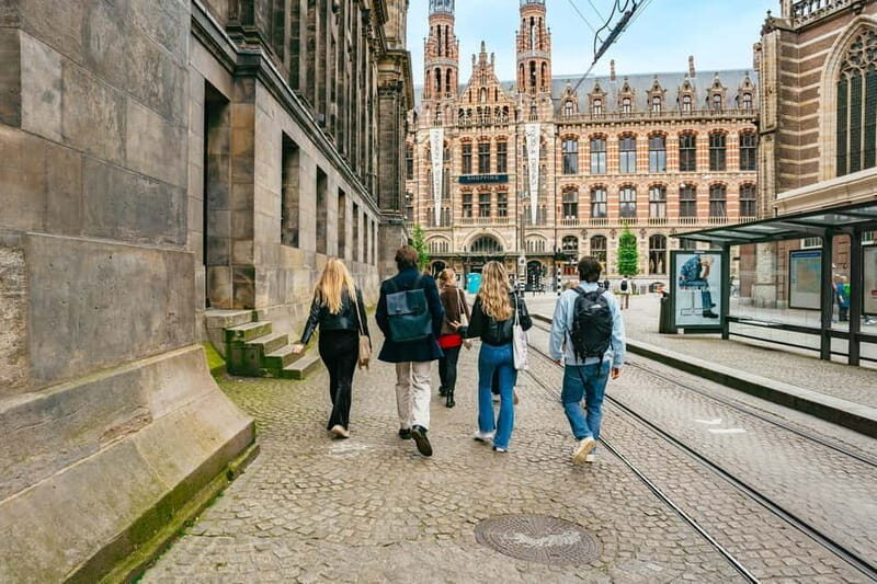Amsterdam: Guided Cultural Walking Tour - Torensluis Bridge and the tiny-house detail: the city’s long memory