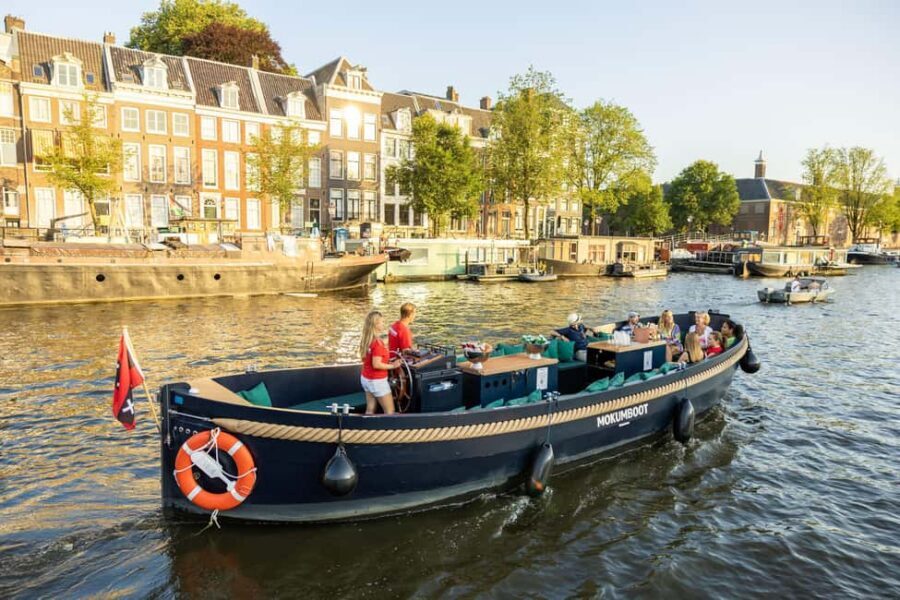 Amsterdam: Guided Open Boat Canal Cruise Including Drink - Key things to know before you go