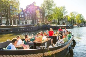 Amsterdam: Guided Open Boat Canal Cruise Including Drink - Getting started at Amsterdam Centraal (and finding the red banner)