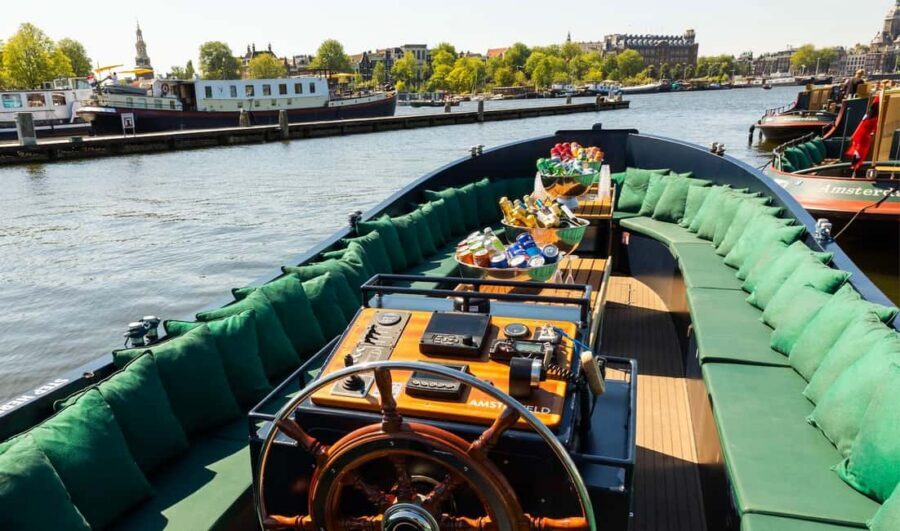 Amsterdam: Guided Open Boat Canal Cruise Including Drink - The route: from photo stops near the station to Magere Brug