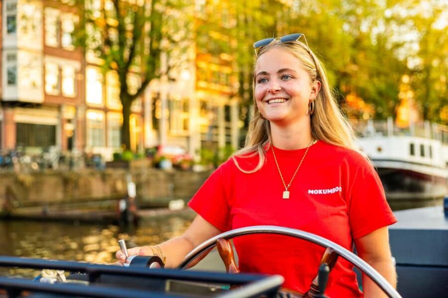 Amsterdam: Guided Open Boat Canal Cruise Including Drink - Price and value: $26 for an hour with guidance and a drink