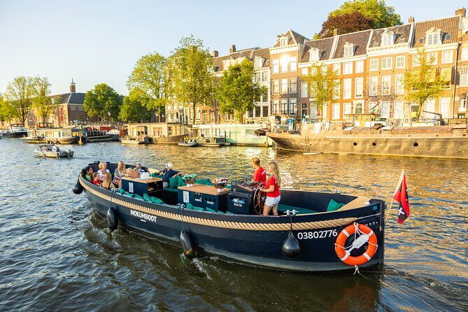 Amsterdam: Guided Open Boat Canal Cruise Unlimited Drinks Option - Price and value: what $23.59 buys in a short Amsterdam window