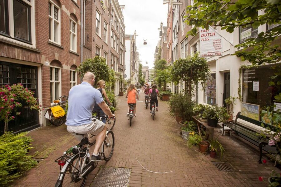 Amsterdam: Hidden Gems & Highlights Guided Bike Tour - Timing and route comfort: when Amsterdam bike traffic feels nicest