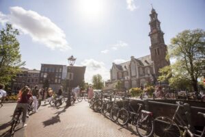 Amsterdam: Hidden Gems & Highlights Guided Bike Tour - The value of paying for bike rental + a local guide
