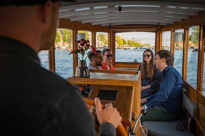 Amsterdam Highlights Canal Cruise with a Drink - Floating Past the Skinny Bridge and Old Town Architecture