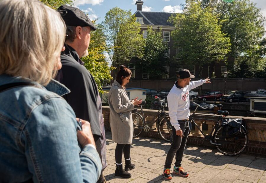 Amsterdam: Highlights & History Walking Tour - Old Town streets: Old Church energy, Chinatown atmosphere, and why the city bends