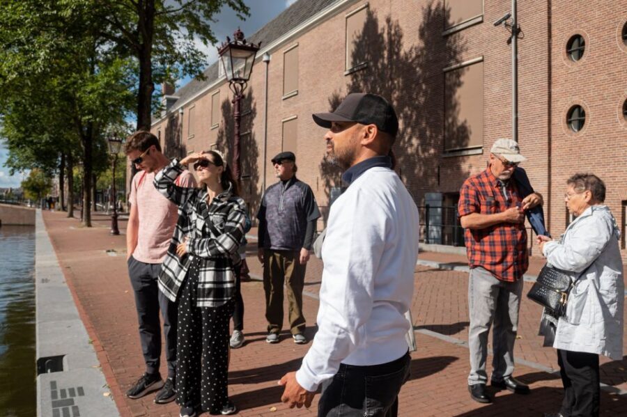 Amsterdam: Highlights & History Walking Tour - Crooked houses and the narrowest street: the fun side of history