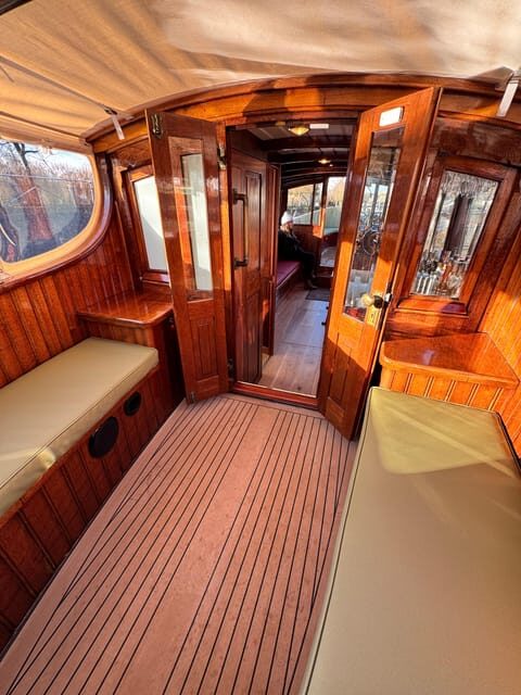 Amsterdam: Historic Boat Cruise with open bar and nibbles - Captain Bow, First Mate Jasper, and the Local-Wired Humor