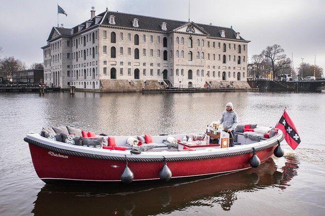 Amsterdam Light Festival: Saloon Boat Cruise + Hot Drinks & Bite - Listening to the guide: clear audio is not guaranteed