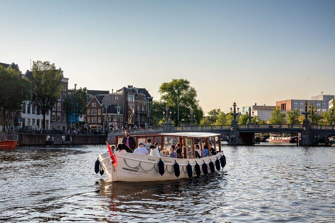 Amsterdam: Luxury Boat Cruise Unlimited Cocktails, Beers & Wines - Where You Start: Dam Square Pickup Behind Krasnapolsky