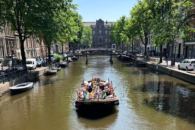 Amsterdam Luxury Boutique Boat tour with Unlimited Beer and Wine - Entering Amsterdam from the canal side (and why it works)