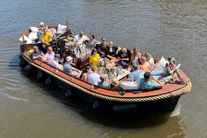 Amsterdam Luxury Boutique Boat tour with Unlimited Beer and Wine - Magere Brug (Skinny Bridge): the photo moment with a story