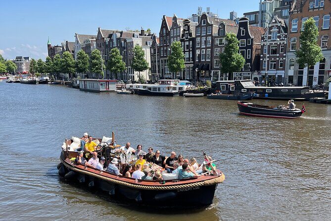 Amsterdam Luxury Boutique Boat tour with Unlimited Beer and Wine - Getting on board at Oudezijds Voorburgwal—and what the boat setup means
