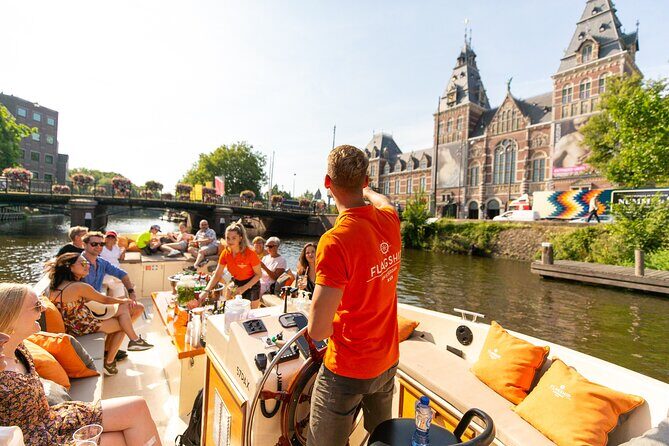 Amsterdam Luxury Canal Cruise + Unlimited Drinks & Bites option - What the boat feels like: step up, blankets, and window realities