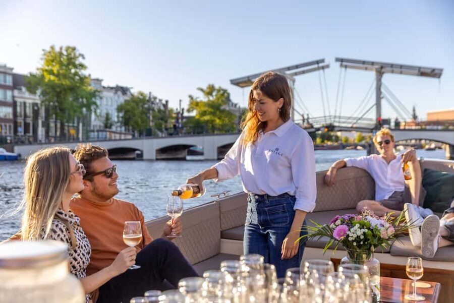 Amsterdam: Luxury Canal Cruise with Optional Snacks & Drinks - Bridges, botanical calm, and why the Skinny Bridge matters