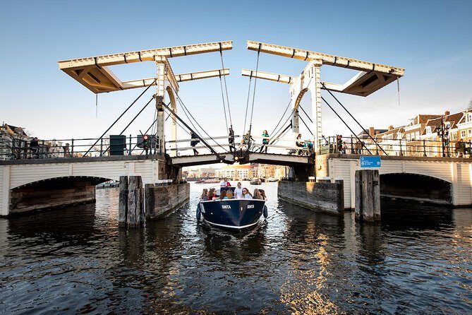 Amsterdam Open Boat Cruise in Old City Center with Live Guide - Open-Air Electric Cruising in Amsterdam’s Old Center