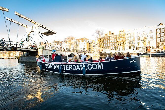 Amsterdam Open Boat Cruise with Live Guide and Two Drinks - Ice Bar Amsterdam, The Cat Cabinet, Cheese Museum, and Other Fun Stops