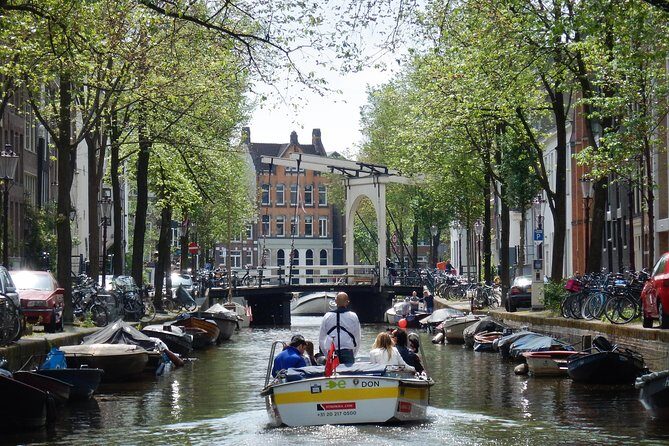 Amsterdam Open Boat Tour with Local Guide - Comfort checklist: smart casual, cold air, and what’s included before departure