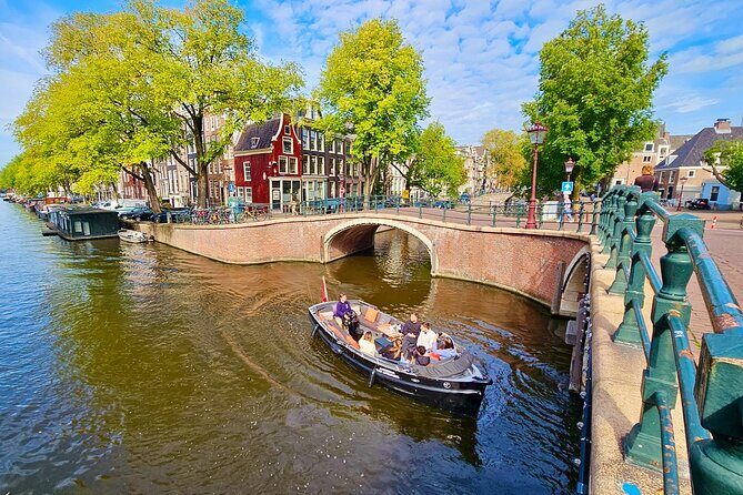 Amsterdam Private Canal Cruise – 90 Minutes through the Old City - Zuiderkerk and Munttoren: church spires and the skyline seen in motion