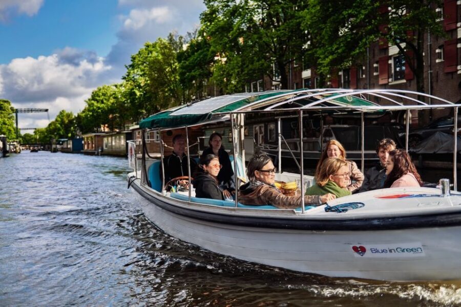 Amsterdam: Private Canal Tour - A small electric boat makes the city feel human