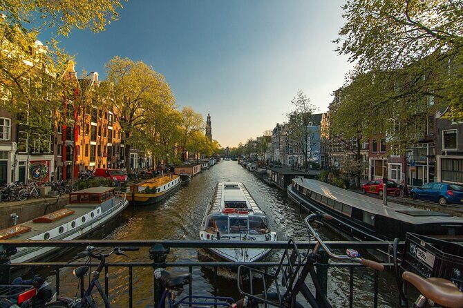 Amsterdam Private Historical Walking Tour - Bloemenmarkt and Spui: flowers on water, books on a square