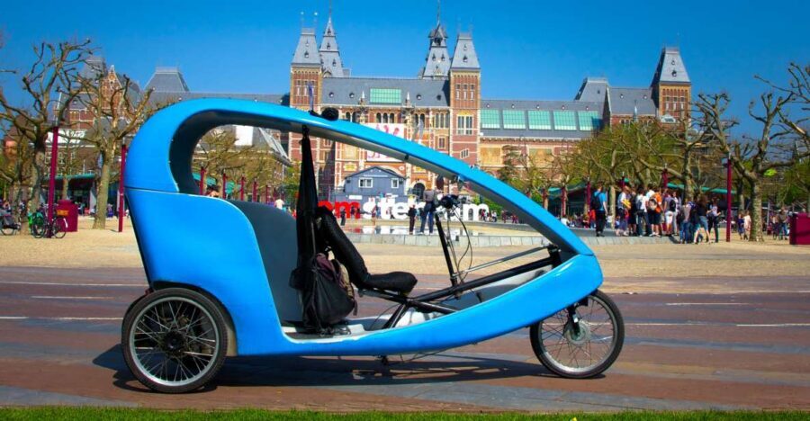 Amsterdam: Private Pedicab Historical Sightseeing Tour - Zeedijk and New Market Square: dikes, markets, and a 15th-century gate