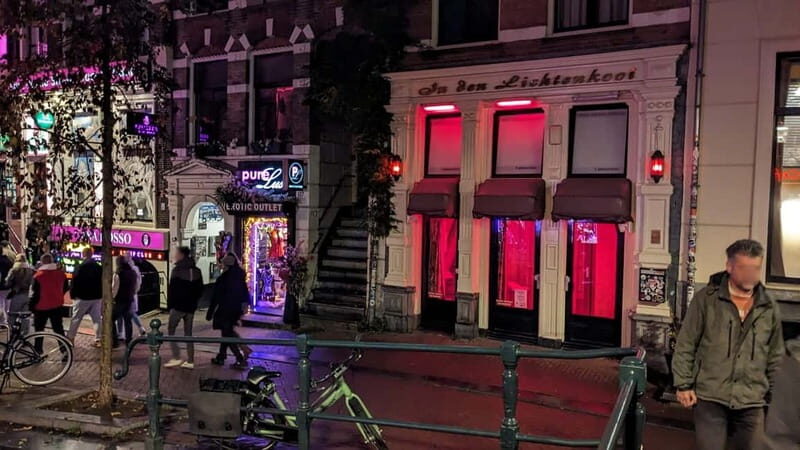 Amsterdam: Red Light District Tour - Dam Square to Condomerie: where the vibe changes fast